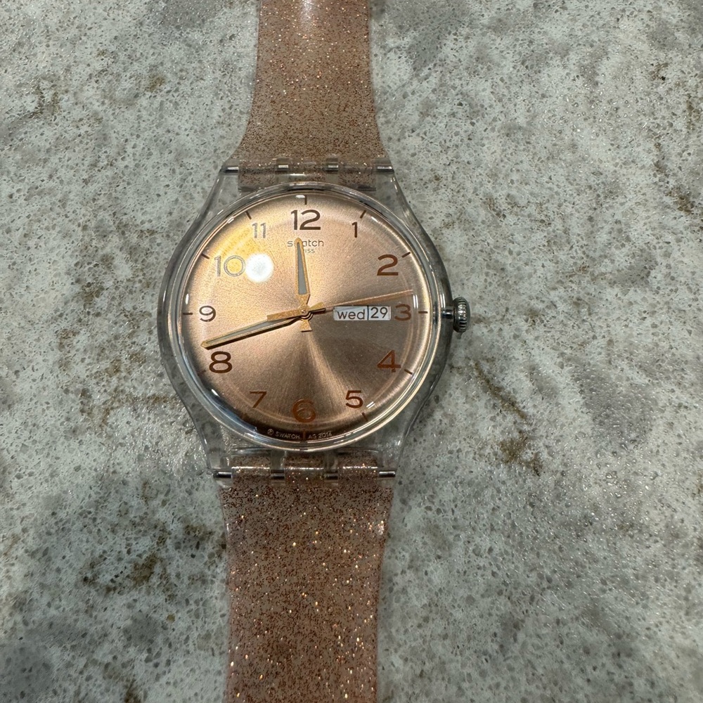 SWATCH watch - Shimmery rose/copper band with iridescent watch face; Day & Date…